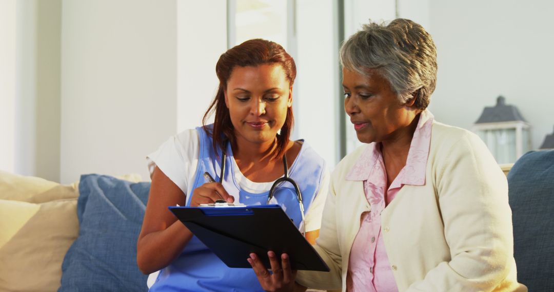 Nurse Assisting Elderly Woman at Home for Medical Checkup - Free Images, Stock Photos and Pictures on Pikwizard.com