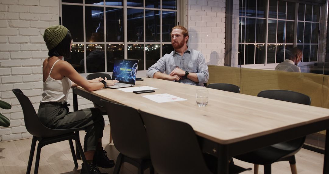 Night Office Meeting with Colleagues Collaborating on Project