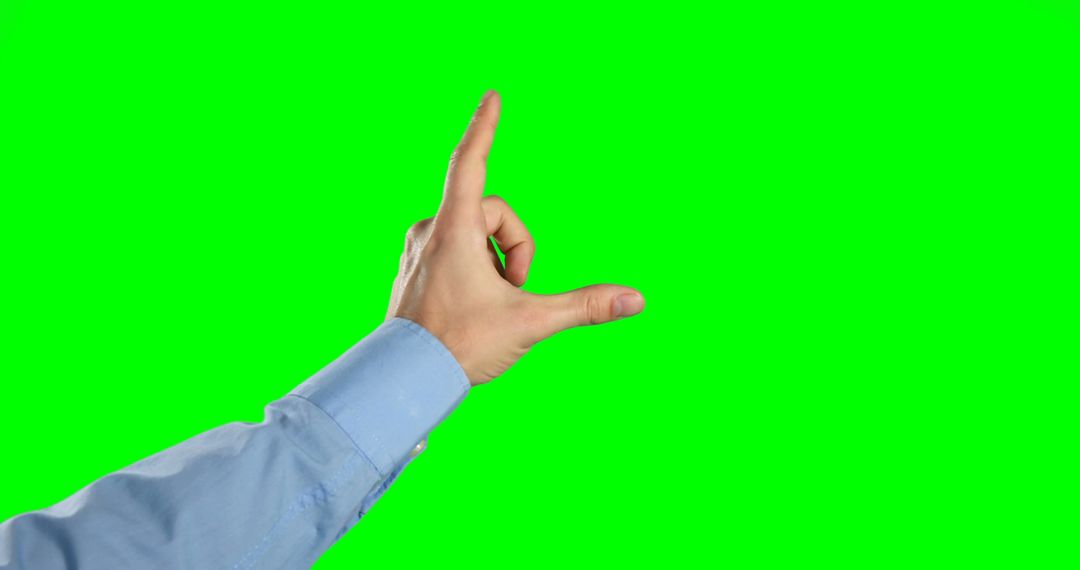 Hand Sign Gesturing Pinching in Front of Green Screen - Free Images, Stock Photos and Pictures on Pikwizard.com