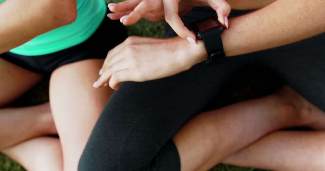 Women Using Smartwatch During Outdoor Exercise - Free Images, Stock Photos and Pictures on Pikwizard.com