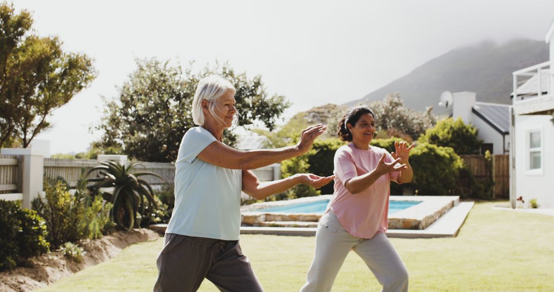 Women Practicing Tai Chi in Backyard Garden - Free Images, Stock Photos and Pictures on Pikwizard.com