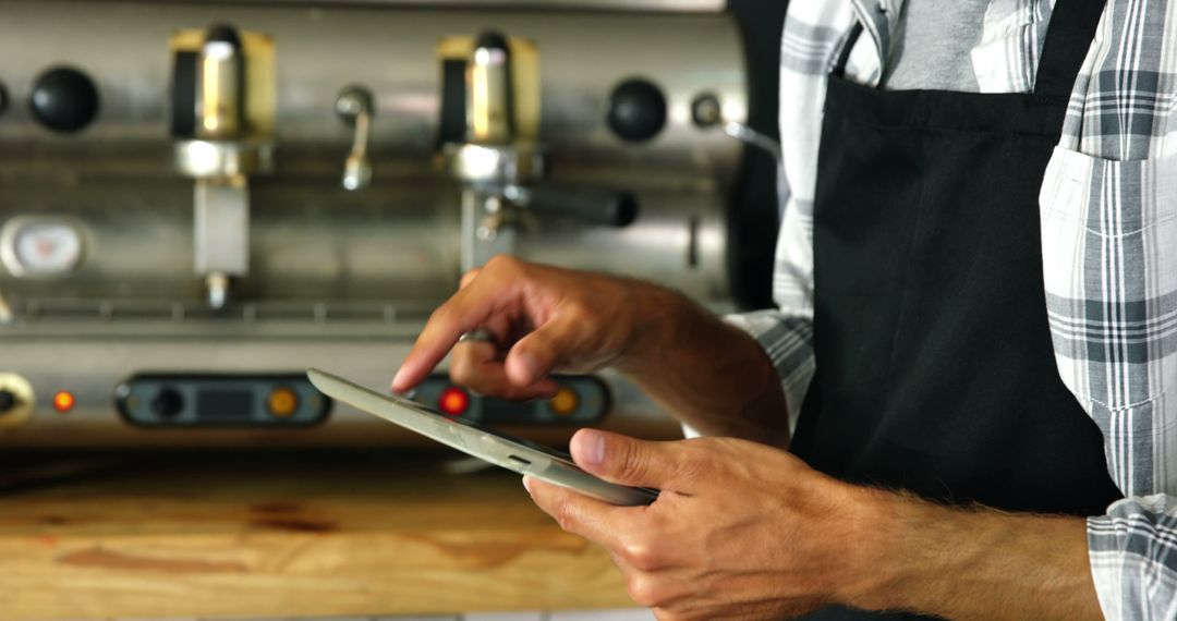 Barista Using Tablet for Coffee Orders - Free Images, Stock Photos and Pictures on Pikwizard.com