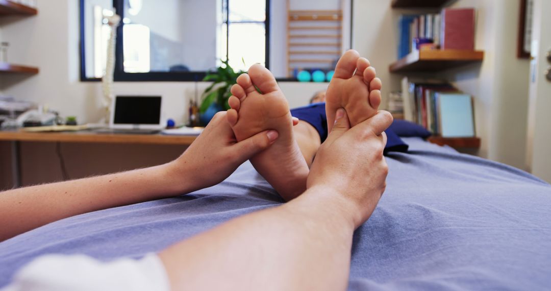 Therapist Giving Professional Reflexology Foot Massage in Modern Clinic - Free Images, Stock Photos and Pictures on Pikwizard.com