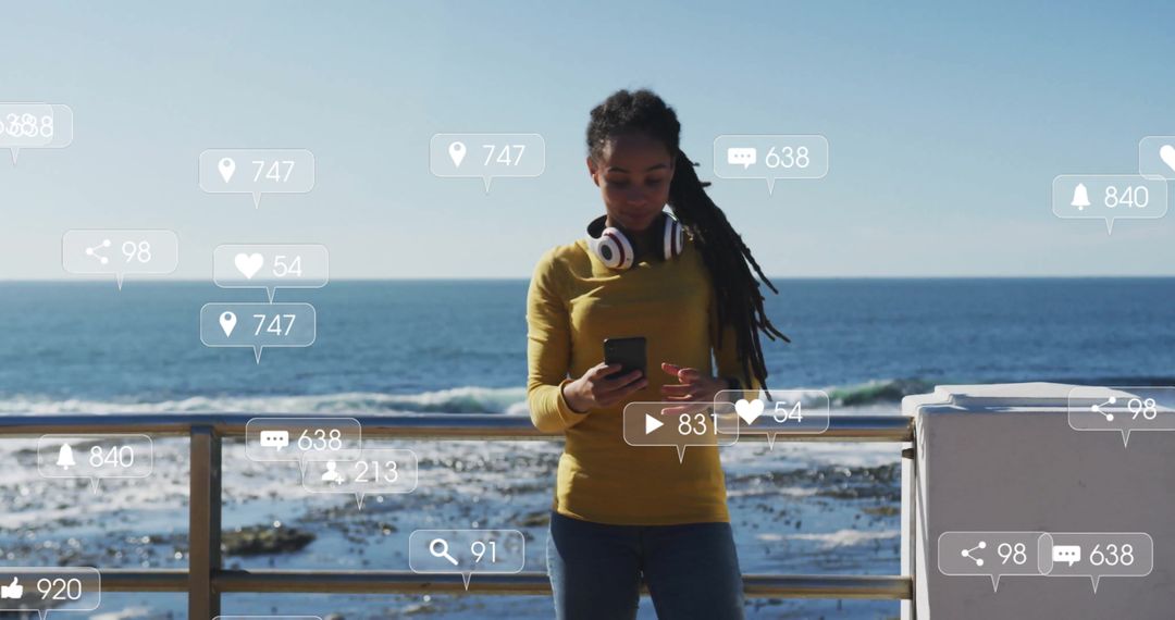 Woman By Ocean Engaging with Social Media on Smartphone