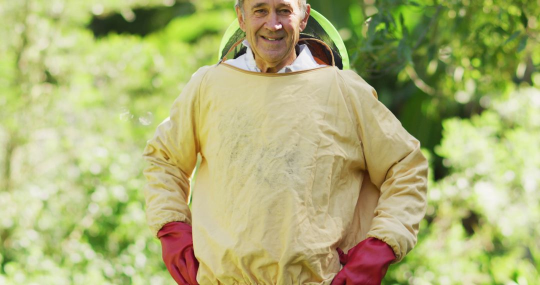 Portrait of smiling caucasian male beekeeper in protective clothing - Free Images, Stock Photos and Pictures on Pikwizard.com