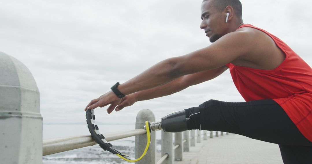 Active Man with Prosthetic Leg Stretching by Seaside - Free Images, Stock Photos and Pictures on Pikwizard.com