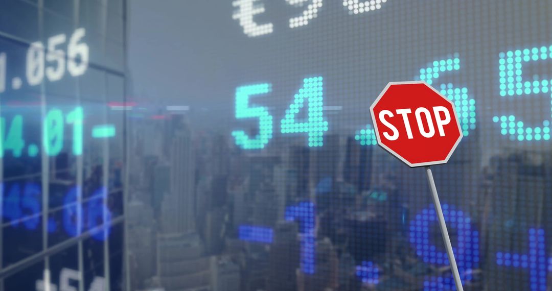 Stop Sign Overlays Financial Data and City Concept Image