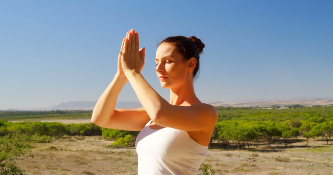 Woman Practicing Yoga Outdoors Enhancing Mindfulness - Free Images, Stock Photos and Pictures on Pikwizard.com