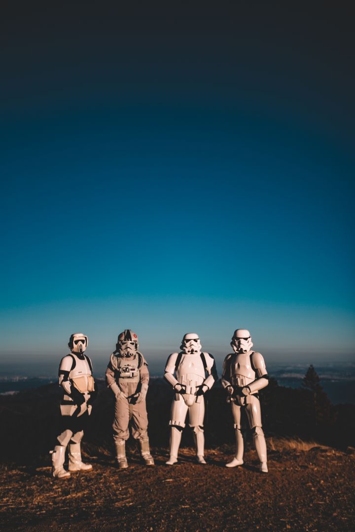Group of People in Space and Stormtrooper Costumes in a Scenic Outdoor Setting - Free Images, Stock Photos and Pictures on Pikwizard.com