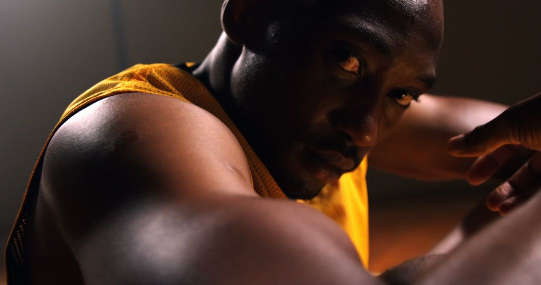 Closeup of Athlete in Focused Stance Wearing Basketball Jersey - Free Images, Stock Photos and Pictures on Pikwizard.com