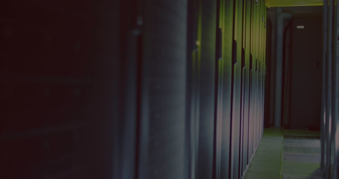 Dimly Lit Empty Server Room with Black Servers