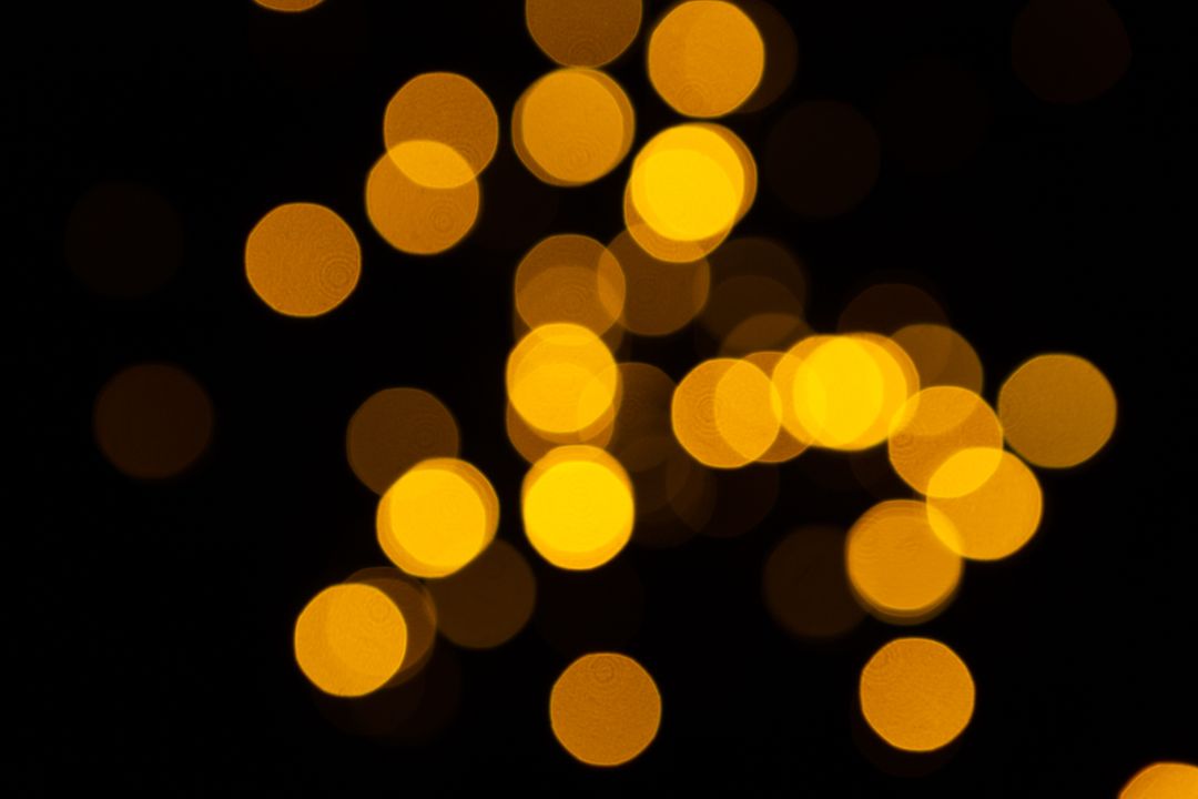Abstract Yellow Bokeh Lights on Black Background - Free Images, Stock Photos and Pictures on Pikwizard.com