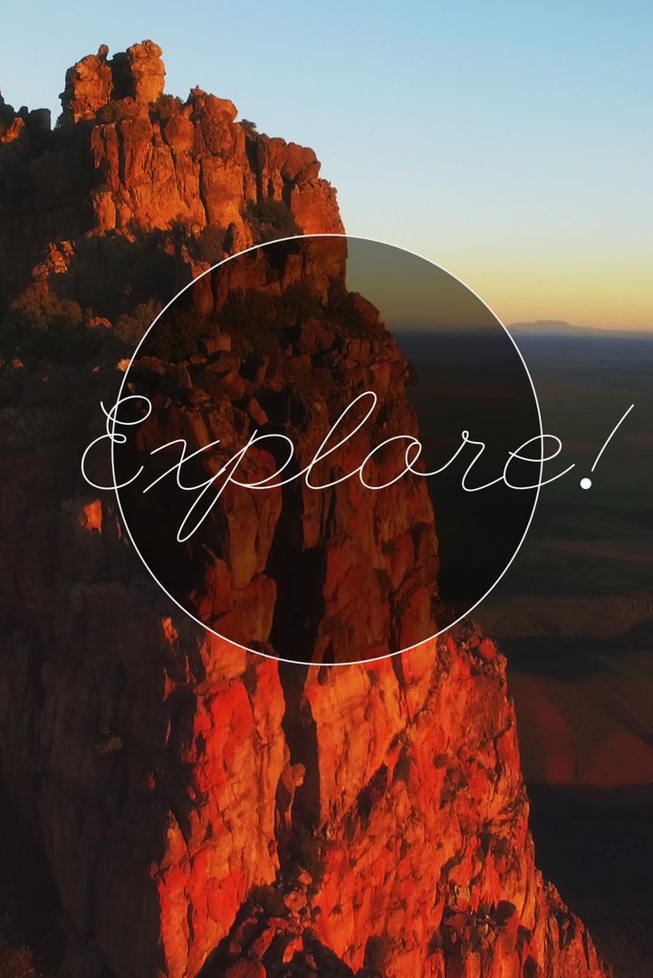 Sunrise on Majestic Cliff Evokes Adventure and Exploration