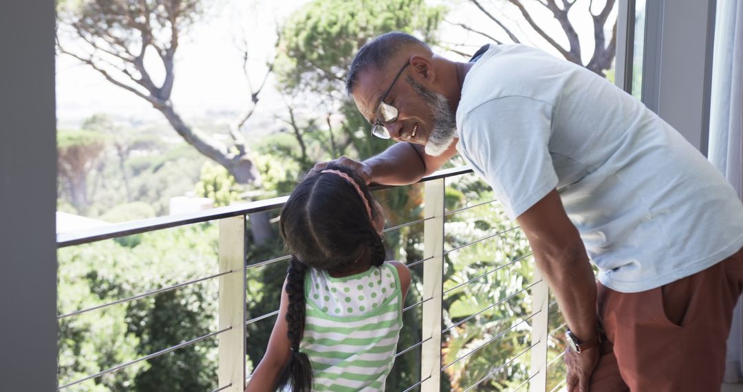 Father and Daughter Enjoying Relaxing Balcony Moment