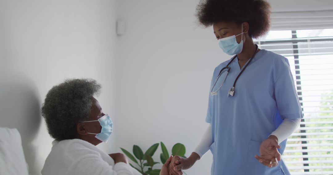 Nurse in Scrubs Comforting Elderly Woman in Hospital Room - Free Images, Stock Photos and Pictures on Pikwizard.com