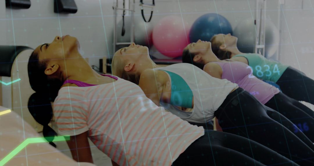 Synchronized Bridge Exercise Class Arching Backs Strengthening Core with Stability Balls