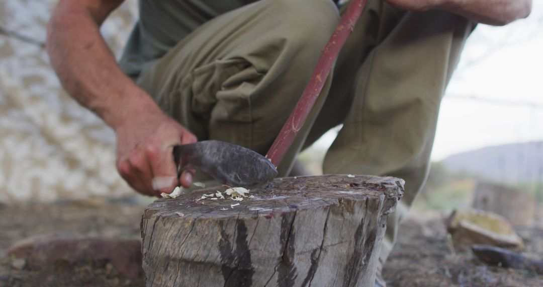 Close-up View of a Man Chopping Wood with an Axe - Free Images, Stock Photos and Pictures on Pikwizard.com