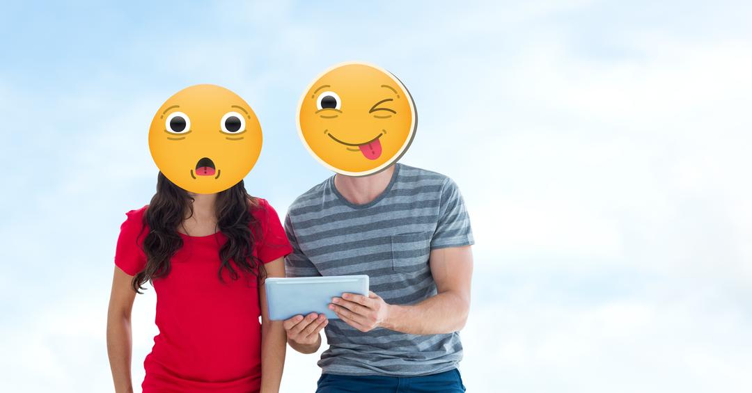 Couple Using Tablet with Emoji Faces Expressing Surprise and Playfulness Outdoors - Free Images, Stock Photos and Pictures on Pikwizard.com