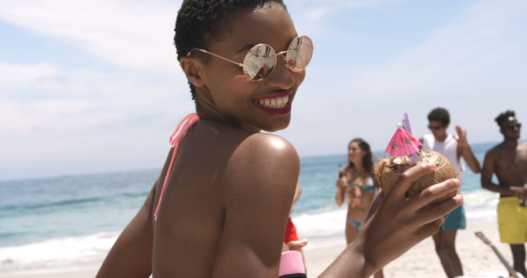Joyful Beach Dance Party with Friends Under Summer Sun