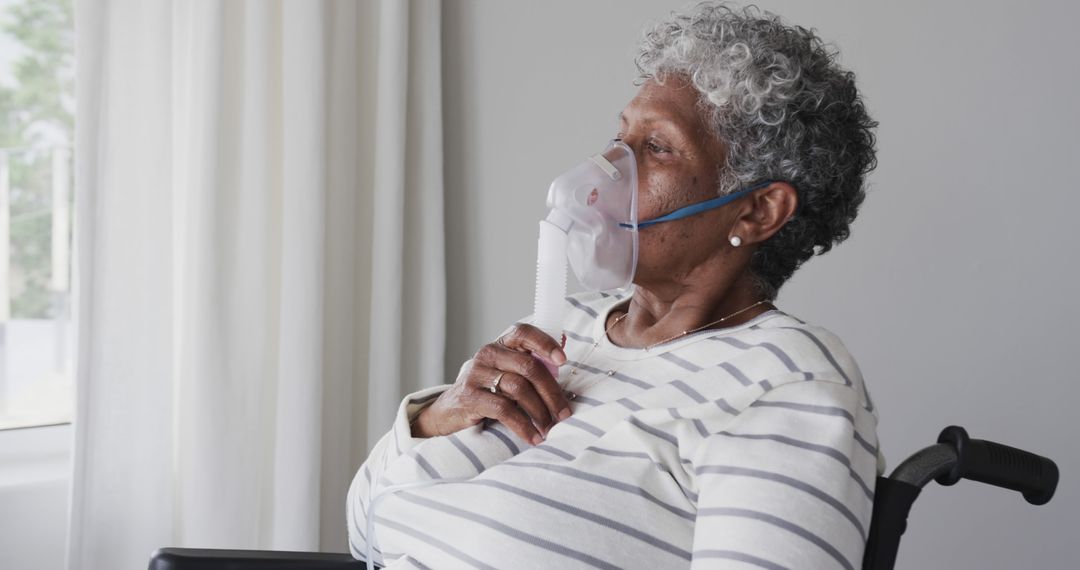 Senior Woman Using Oxygen Mask for Breathing Assistance - Free Images, Stock Photos and Pictures on Pikwizard.com