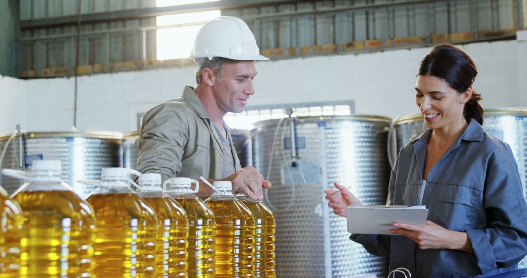 Engineers Checking Oil Production Quality Control in Factory - Free Images, Stock Photos and Pictures on Pikwizard.com