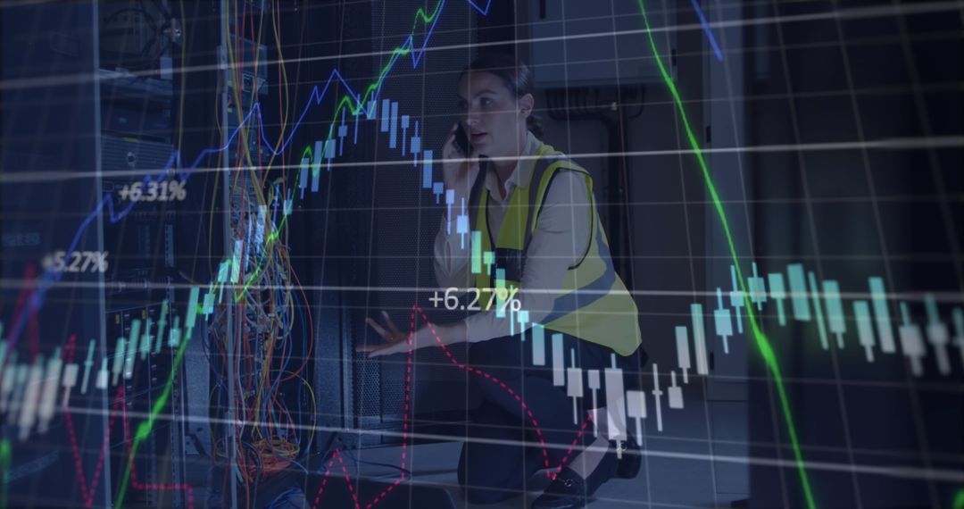 IT Engineer Analyzing Data with Digital Stock Market Graph Overlay