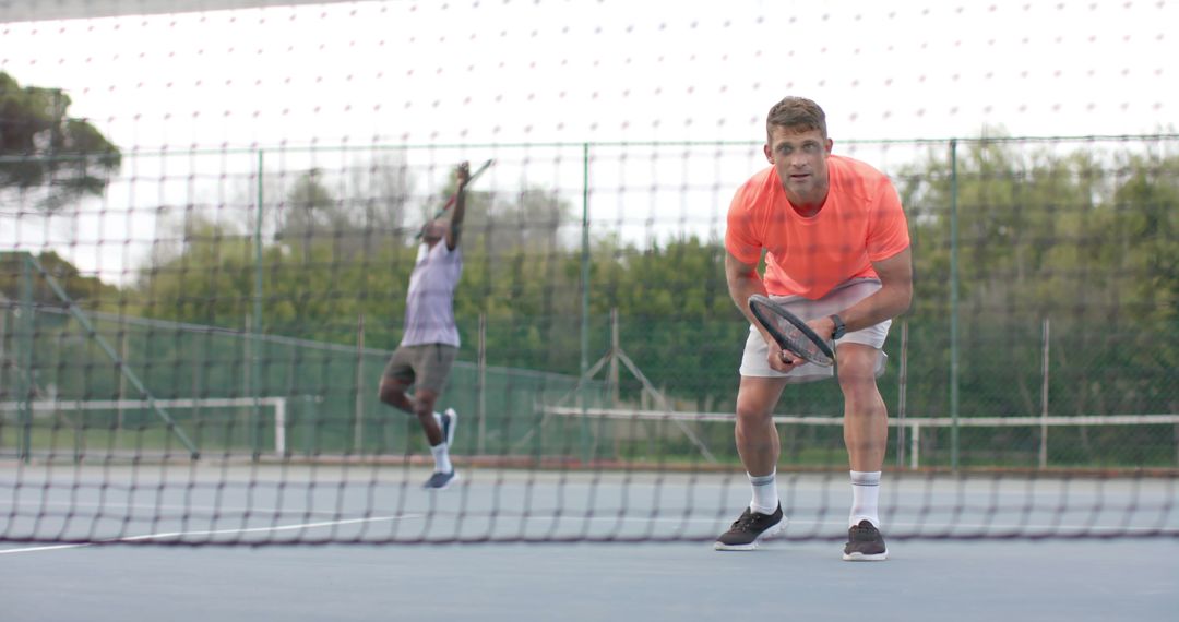 Tennis Players Focusing on Court During Intense Match - Free Images, Stock Photos and Pictures on Pikwizard.com