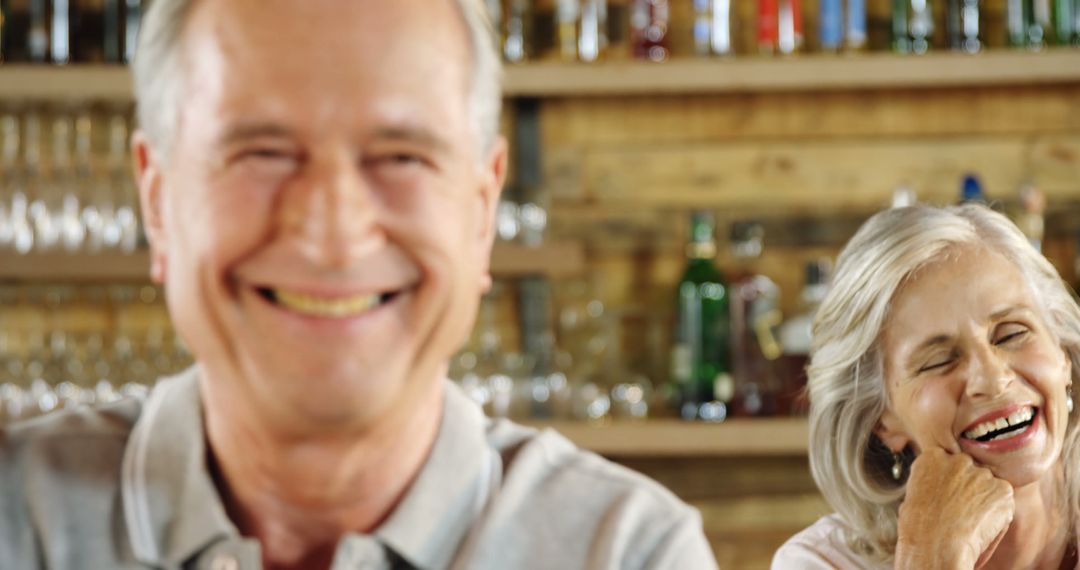 Senior Couple Smiling Warmly in Cozy Cafe Environment