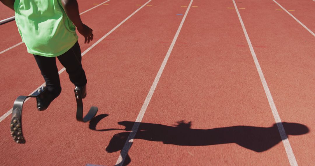 Athlete with Prosthetic Legs Running Track during Competition - Free Images, Stock Photos and Pictures on Pikwizard.com