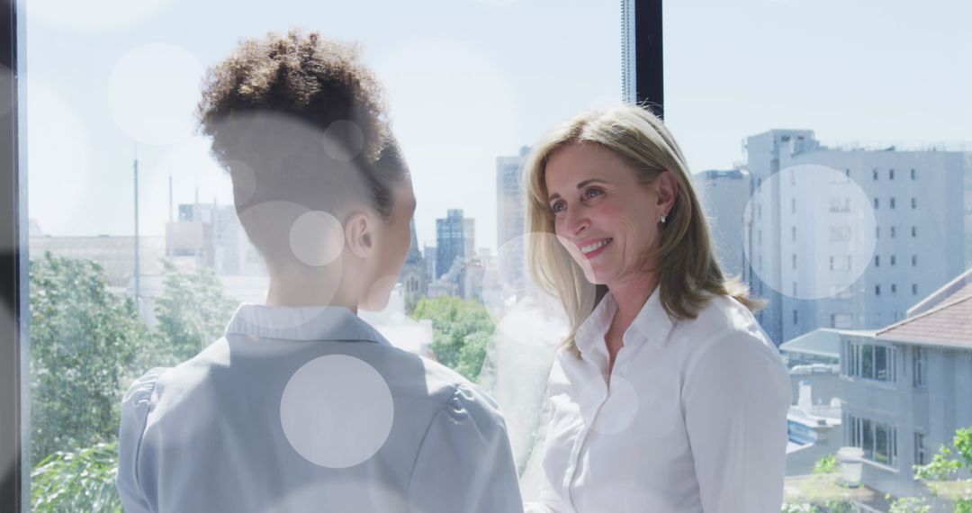 Diverse Businesswomen Engaging in Office Discussion