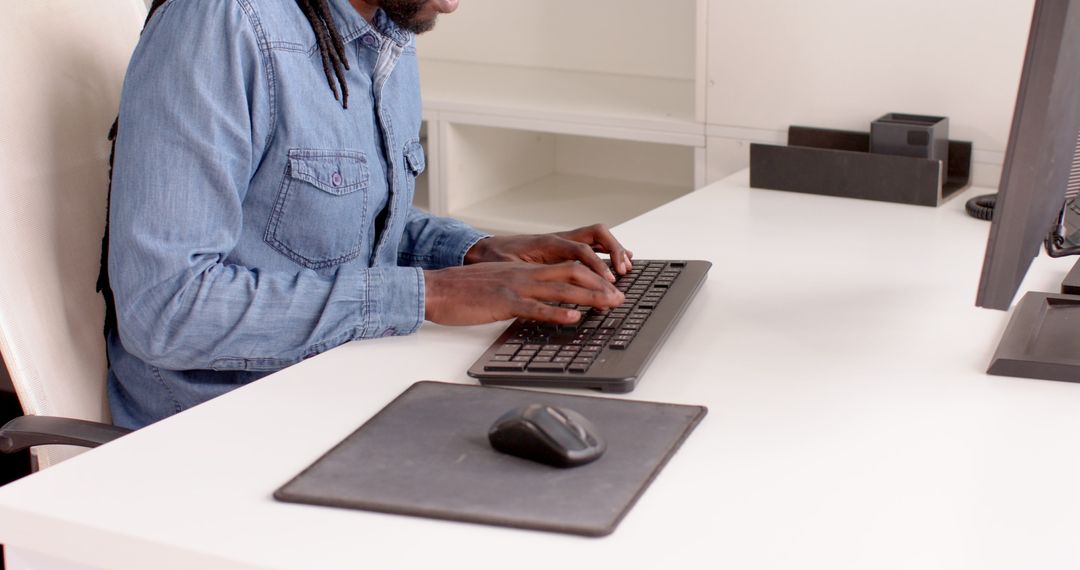 Business Professional Typing on Office Keyboard at Work Desk
