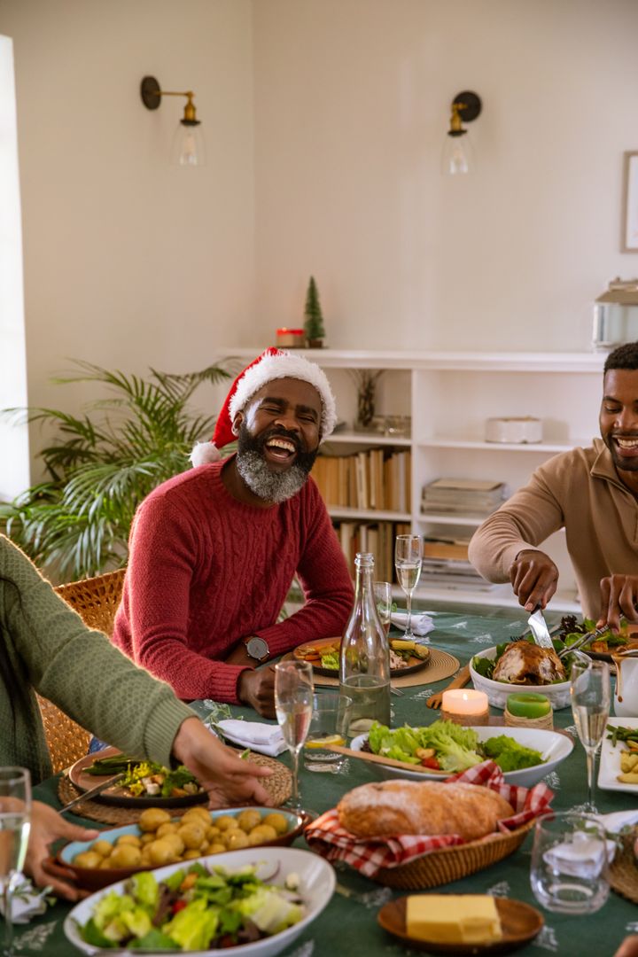 Festive Dinner Gathering with Friends Laughing and Enjoying Meal