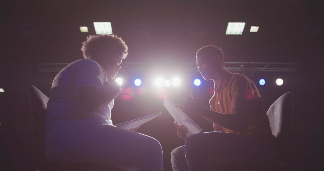 Dramatic Theater Rehearsal Under Stage Lights - Free Images, Stock Photos and Pictures on Pikwizard.com