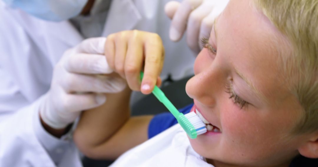 Child Receiving Dental Checkup while Brushing Teeth - Free Images, Stock Photos and Pictures on Pikwizard.com