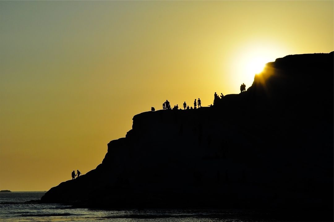 People Standing on Cliff at Sunset - Free Images, Stock Photos and Pictures on Pikwizard.com