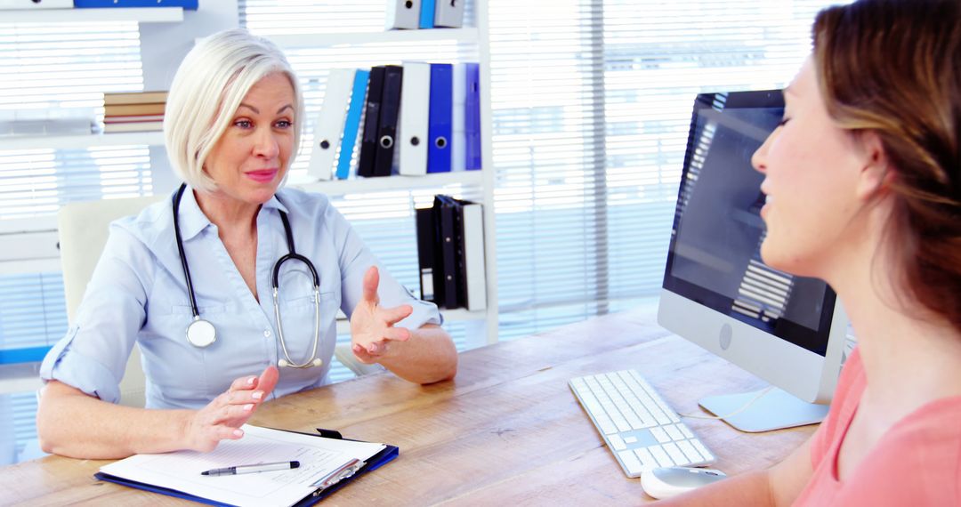 Doctor Consulting with Patient in Modern Office - Free Images, Stock Photos and Pictures on Pikwizard.com