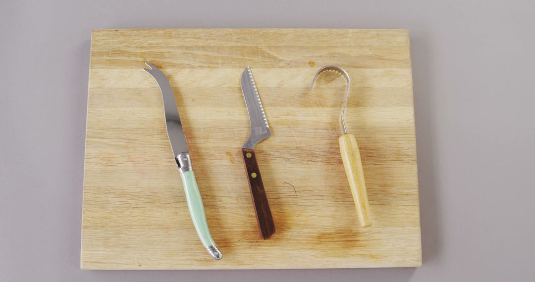 Various Cheeses Knives on Wooden Cutting Board - Free Images, Stock Photos and Pictures on Pikwizard.com