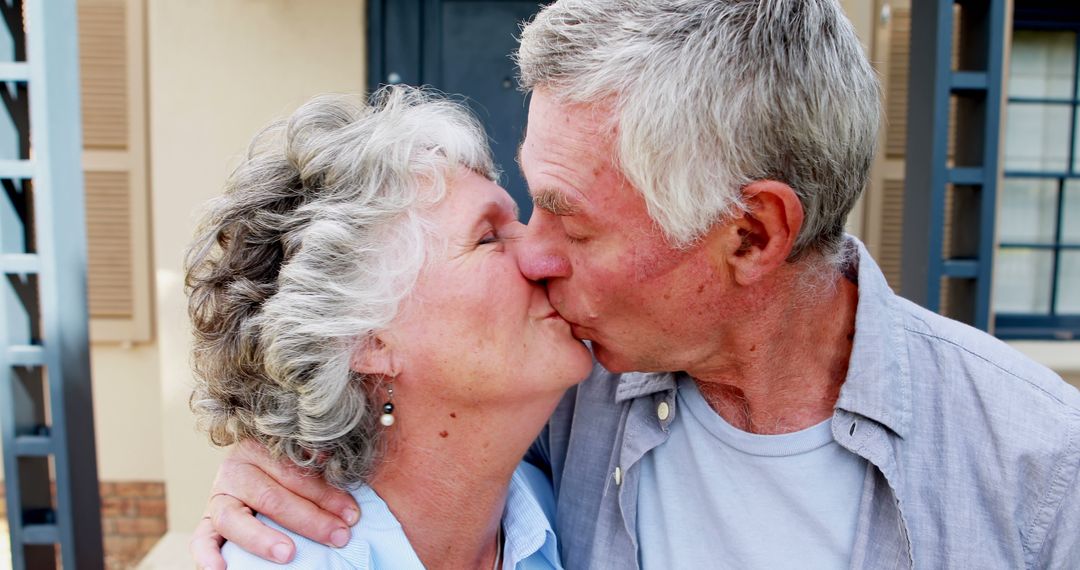 Senior Couple Sharing a Loving Kiss Outdoor