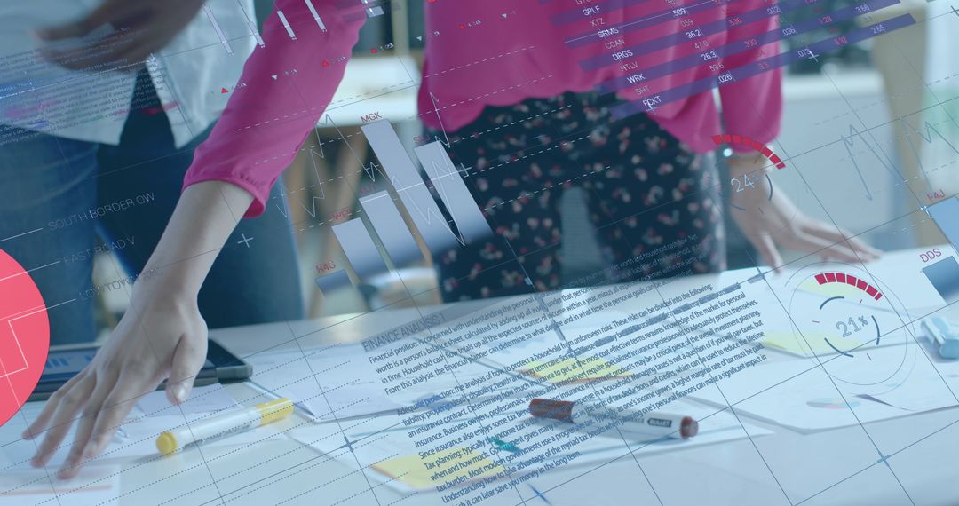 Colleagues Analyzing Data with Modern Technology in Office