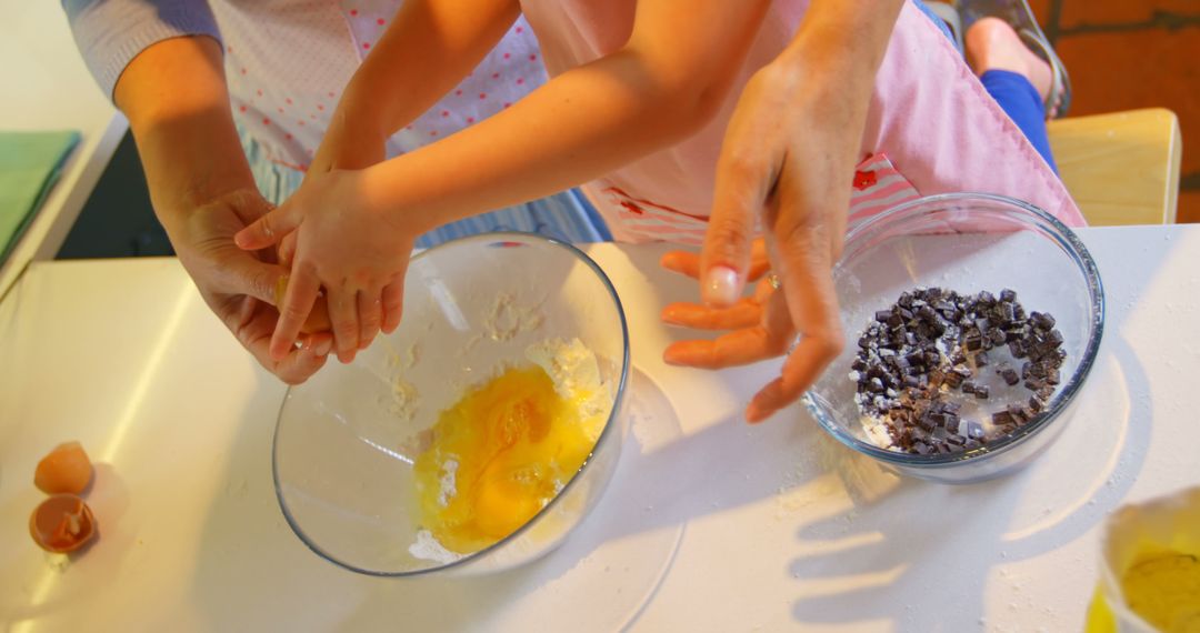 Child and Parent Baking Together in Kitchen - Free Images, Stock Photos and Pictures on Pikwizard.com