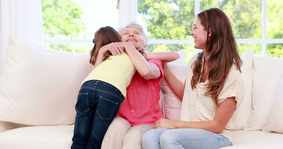 Three Generations of Female Family Members Hugging on Sofa - Free Images, Stock Photos and Pictures on Pikwizard.com