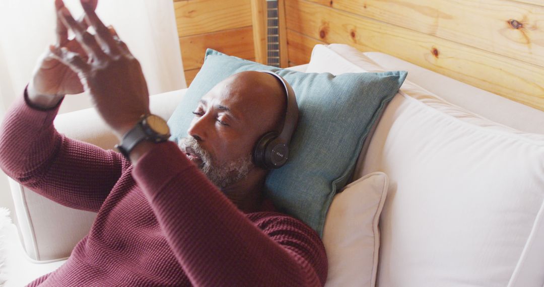 Relaxing Middle-Aged Man Listening to Music with Headphones - Free Images, Stock Photos and Pictures on Pikwizard.com