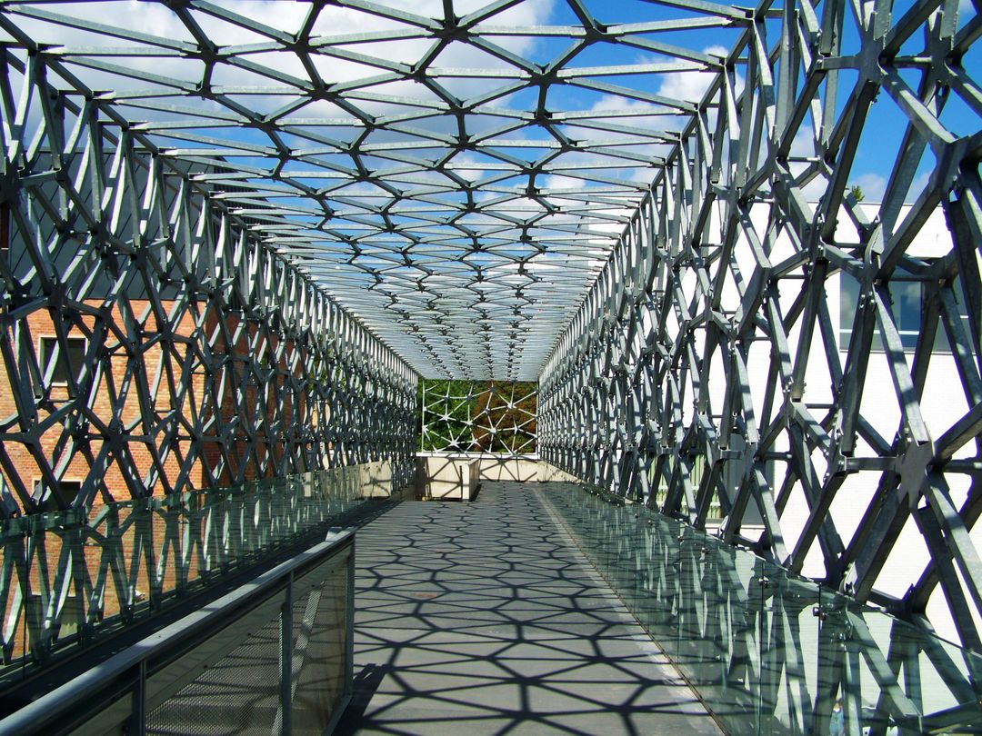 Futuristic Geometric Metal Walkway with Dramatic Shadows - Free Images, Stock Photos and Pictures on Pikwizard.com