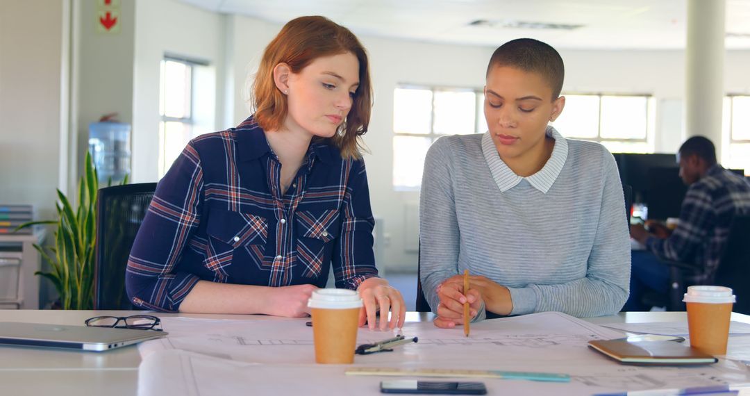 Two Female Architects Collaborating in Modern Office - Free Images, Stock Photos and Pictures on Pikwizard.com