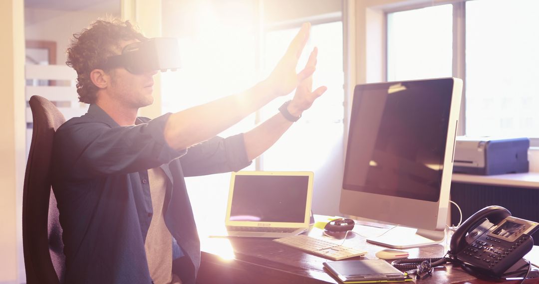 Man Using VR Headset in Modern Office at Sunrise - Free Images, Stock Photos and Pictures on Pikwizard.com