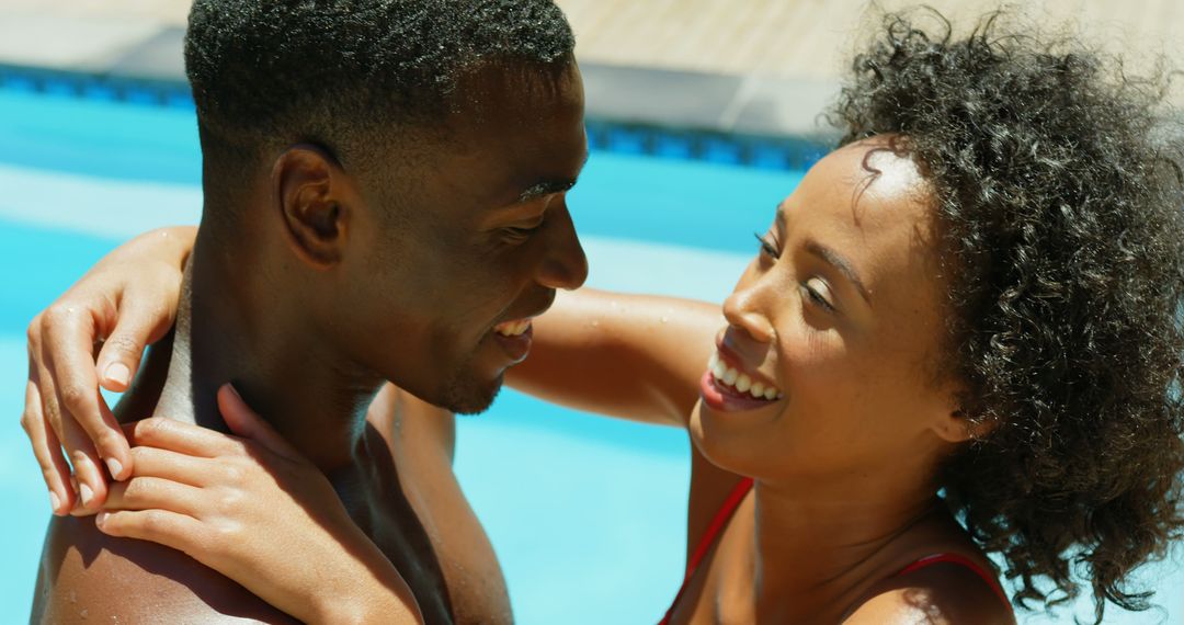Side view of young black couple embracing each other near swimming pool - Free Images, Stock Photos and Pictures on Pikwizard.com