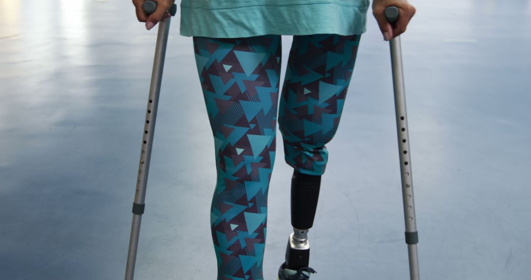 Person with Prosthetic Leg Walking with Crutches - Free Images, Stock Photos and Pictures on Pikwizard.com