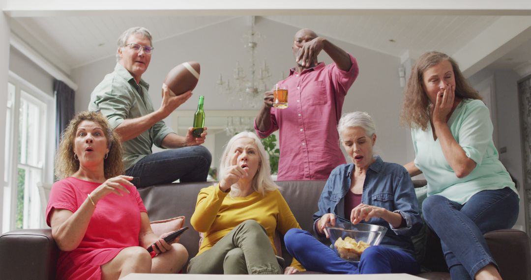 Image of happy diverse senior friends cheering while watching american football match in tv - Free Images, Stock Photos and Pictures on Pikwizard.com