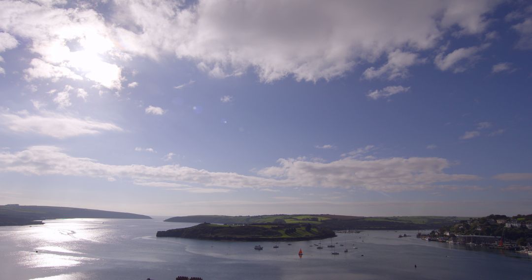 Scenic Coastal View of Calm Waters and Rolling Hills - Free Images, Stock Photos and Pictures on Pikwizard.com