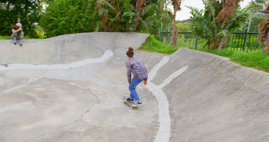 Young Skateboarder Riding in Concrete Skate Park - Free Images, Stock Photos and Pictures on Pikwizard.com